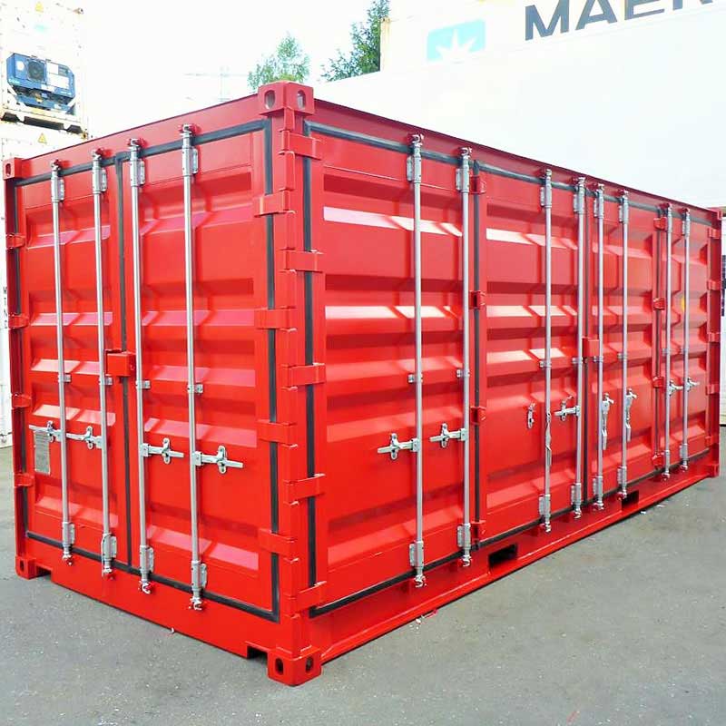 Contenedor marítimo Open Side de 20 pies color rojo, fabricado en acero resistente, con puertas laterales abatibles a lo largo del costado para acceso total a la carga, ideal para carga y descarga de mercancías voluminosas, almacenamiento industrial y uso logístico, ubicado en un patio exterior.